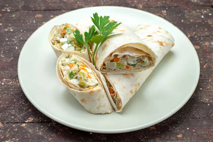 front-view-sandwich-rolls-sliced-with-salad-meat-inside-white-plate-brown