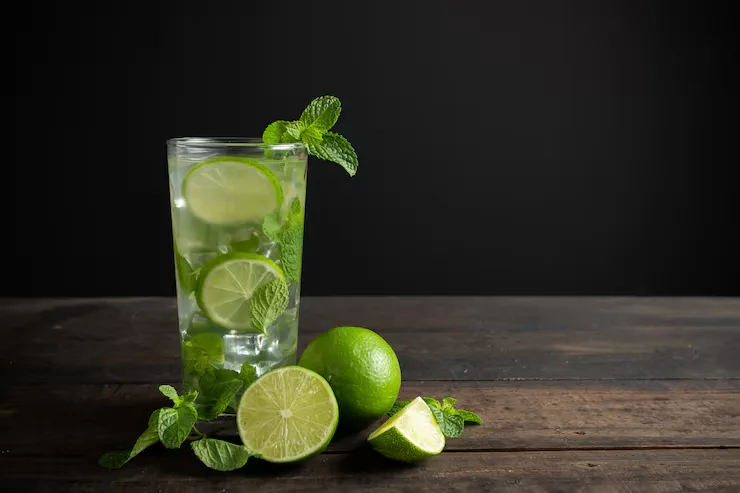 mojito-drink-with-lime-lemon-mint-wood-table