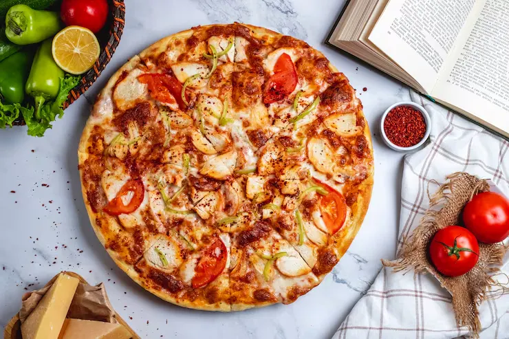 top-view-pizza-with-chicken-green-chili-pepper-tomatoes-cheese-table